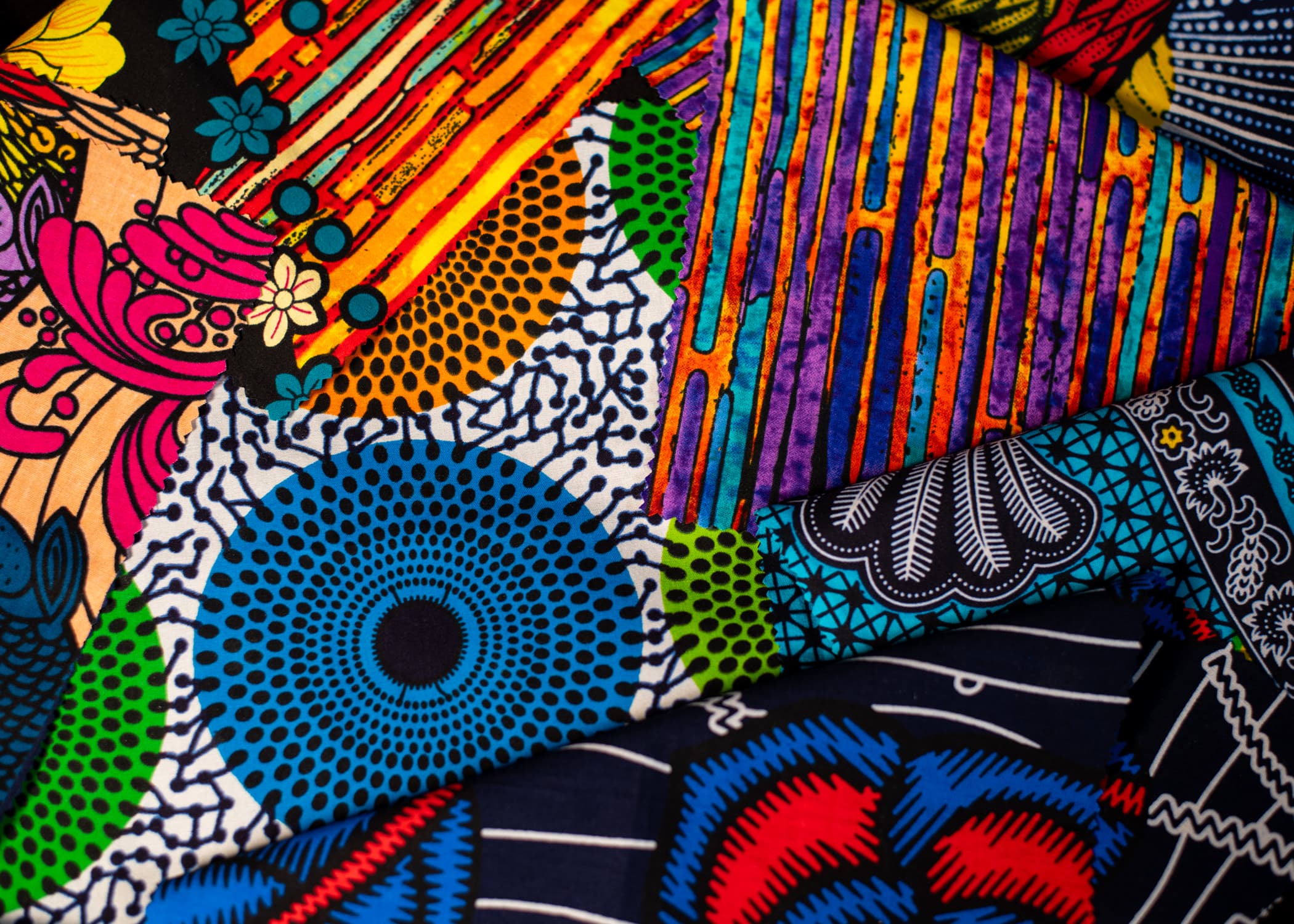 An assortment of brightly colored, patterned fabric